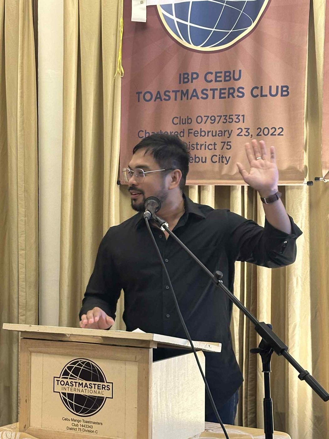 Dave Visaya speaking at a Toastmasters lectern